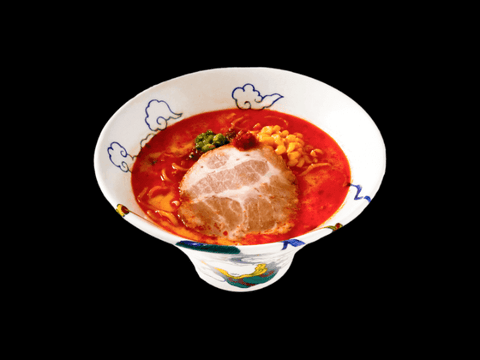RAIJIN's Spicy Tonkotsu Frozen Ramen in a decorative bowl, featuring rich pork bone broth with umami-rich vegetables and unique spices