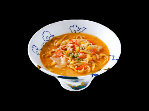 Ramen RAIJIN's Vegan Miso Frozen Ramen in a decorative bowl, featuring rich miso broth, fresh seasonal veggies, and an umami-infused delight.