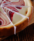 Strawberry Swirl Cheesecake with rich strawberries and creamy texture on a wooden board, perfect dessert for any occasion.